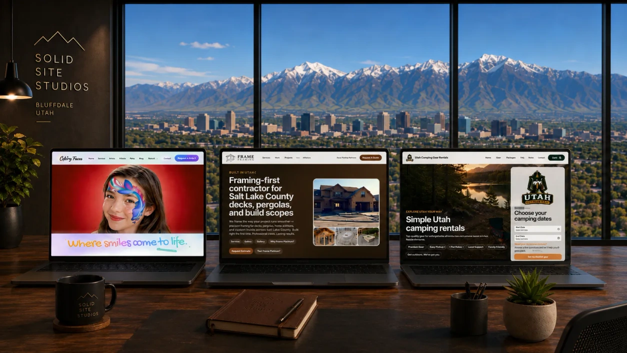 Solid Site Studios workspace overlooking Utah mountains with three published client websites on screen